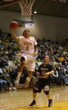 Valparaiso University's Jordan Coleman shoots over Purdue Calumet's Drew Ridlen