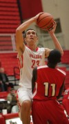 Crown Points's Braxton Rice shoots over Morton's Xavier Johnson