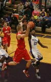 Merrillville's B.J. Jenkins tries to stop Munster's Nate Bubash