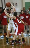 Kouts' Rebekeh Case is guarded by Hebron's Emily DeFries 