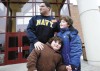 Navy serviceman returns from Middle East, greets son at school