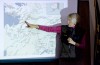 Three-time Iditarod musher, dog, visit students