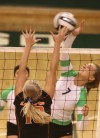 LaPorte's Clair Marshall tries to block a spike attempt by Valparaiso's Madison Olson.