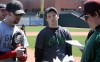 Paul Lukas listens for his turn at bat during RailCats open tryouts