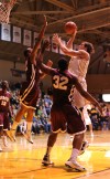 Valparaiso University's Kevin Van Wijk scores over Robert Morris' Dem