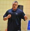 Rudy Ruettiger stands in front a crowd