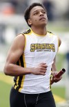 Marian Catholic's Dillion Burns runs in the 400-meter relay during Saturday's Stagg Invitational.