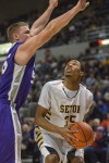 Seton's Johnny Patterson faces a tough defense from Harrisburg's Dakota Upchurch in the 2A state championship game.