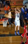 Lake Central's Matt Meneghetti shoots a 3-pointer against Morton's Darius Coty on Friday in the Class 4A West Side Sectional.