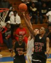 21st Century's Louis Brown scores over Pioneer's Matthew Dorris