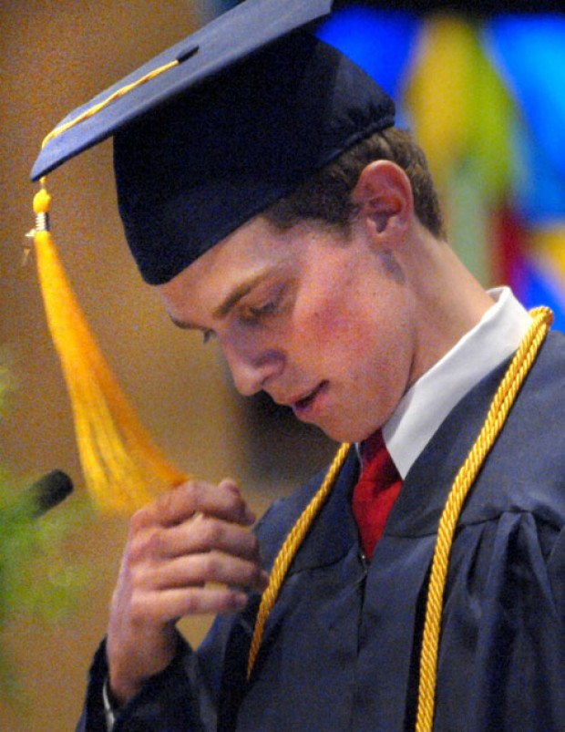 Central Catholic graduate Jessica Dawn Kohn clasps her hands in prayer during graduation ceremony at Holy Trinity Church in Bloomington, Illinois, ... - 4f766fa3770ca.preview-620