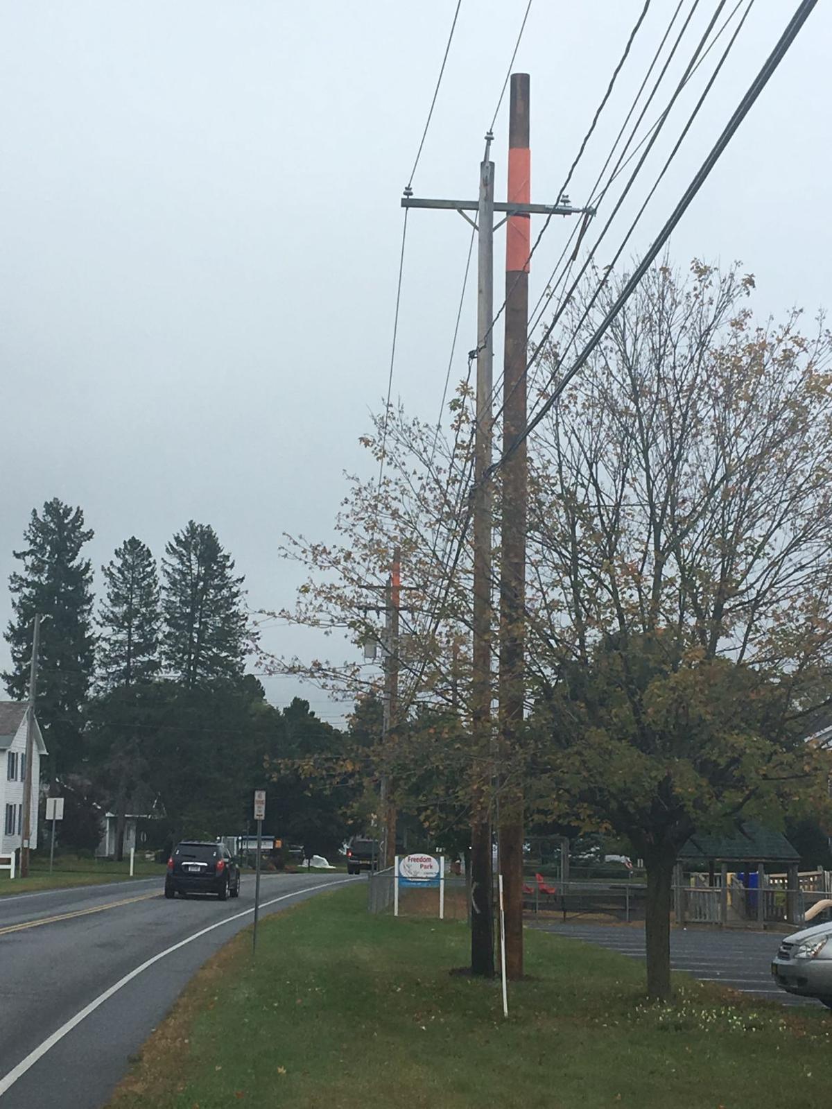 New utility poles going up around region, old ones staying for now as