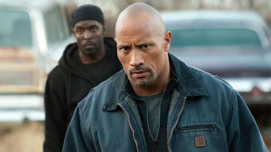 Movie review: The Rock's inexperience helps sell 'Snitch'
