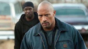 Movie review: The Rock's inexperience helps sell 'Snitch'