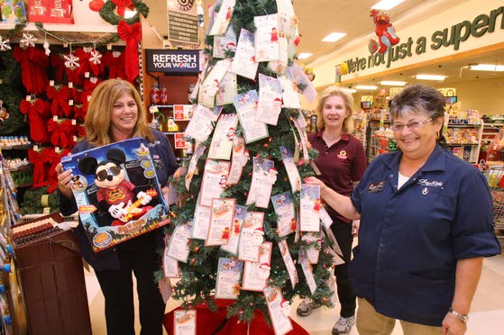 Volunteers in local gift tree programs work to make sure every child gets a holiday present