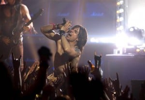 Film review: 'Rock of Ages' shows little glee for hair-metal era