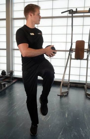Your Workout: Squat with knee lift and torso rotation