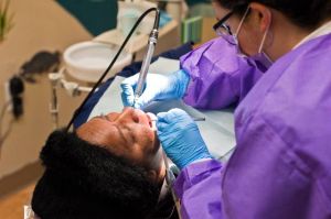 Patients line up before sunrise for Sunshine Dentistry's clinic