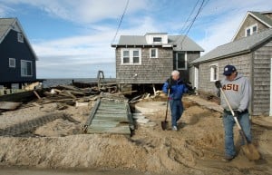  : Resident of Reeds Beach, Miiddle Twp. clean up sand and debris in front of a home on North Beach Ave in Reeds Beach. Residents of Cape May County deal with the clean-up in the wake of Hurricane Sandy. Wednesday Oct. 31, 2012. (Dale Gerhard/Press of Atlantic City)
 - Photo by Dale Gerhard