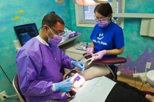 Patients line up before sunrise for Sunshine Dentistry's clinic