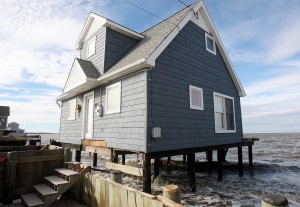  : Damaged homes on North Beach Ave on the Delaware Bay in Reeds Beach, Middle Township. Residents of Cape May County deal with the clean-up in the wake of Hurricane Sandy. Wednesday Oct. 31, 2012. (Dale Gerhard/Press of Atlantic City)
 - Photo by Dale Gerhard