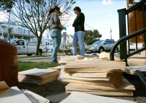  : Sea Isle city employees Lisa Rutledge (left) and Vicki Pittaluga, stand in front of a pile of city files drying out in front of city hall. Sea Isle City city hall was flooded for the first time since 1962. Residents of Cape May County deal with the clean-up in the wake of Hurricane Sandy. Wednesday Oct. 31, 2012. (Dale Gerhard/Press of Atlantic City)
 - Photo by Dale Gerhard
