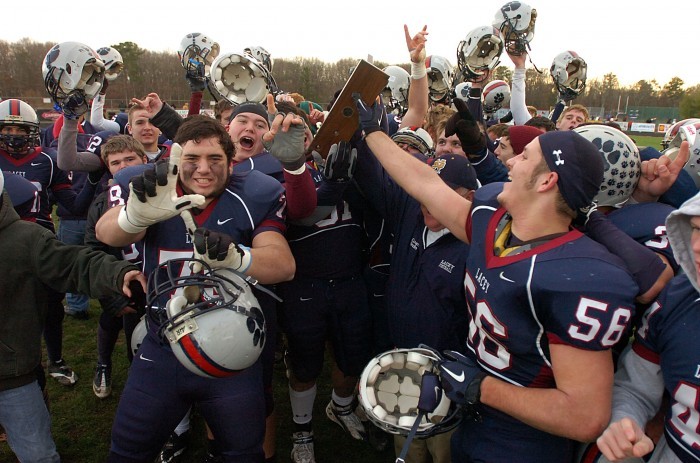 Lacey football players celebrate after beating Delsea