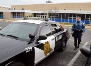 Increasing Patrols: Hamilton Township Police officer, Nicole Nelson, of Mays Landing, leaving Oakcrest High School, in Mays Landing. In the wake of last months Newtown, Conn. school massacre the township has stepped up patrols and is working with schools and other public facilities to ensure safety. Thursday, January, 17, 2013( Press of Atlantic City/ Danny Drake)
 - Photo by Danny Drake