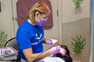 Patients line up before sunrise for Sunshine Dentistry's clinic