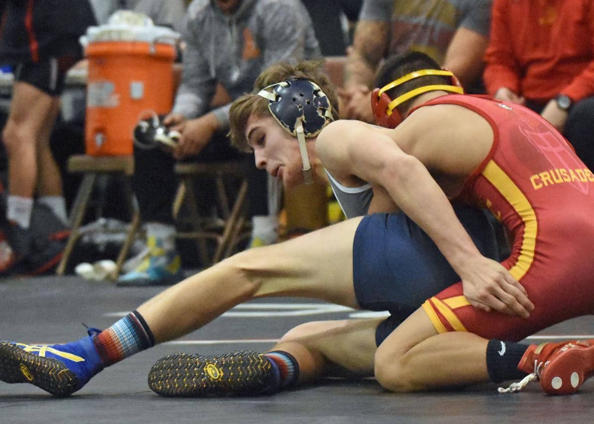 How are college wrestling rankings determined?