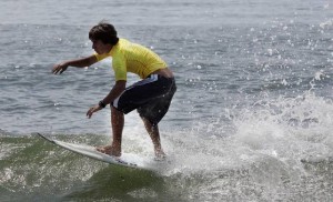 Scores of surfers score big despite uncooperative waves