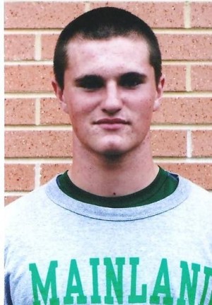 In the huddle with Mainland Regional kicker Jim Cooper