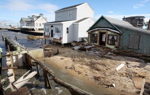  : Damaged homes on South Beach Ave on the Delaware Bay in Reeds Beach, Middle Township. Residents of Cape May County deal with the clean-up in the wake of Hurricane Sandy. Wednesday Oct. 31, 2012. (Dale Gerhard/Press of Atlantic City)
 - Photo by Dale Gerhard