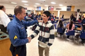 Increasing Patrols: Hamilton Township Police Sgt. Greg Ciambrone, of Mays Landing, talks with student, Jeremy Graham, 14 of Mays Landing, during a lunch period at Oakcrest High School, in Mays Landing. In the wake of last months Newtown, Conn. school massacre the township has stepped up patrols and is working with schools and other public facilities to ensure safety. Thursday, January, 17, 2013( Press of Atlantic City/ Danny Drake)
 - Photo by Danny Drake