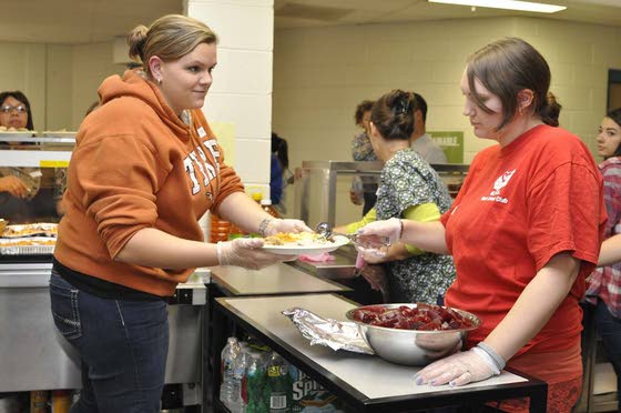 Three MTHS clubs join to stage dinner for Caring for Kids clients