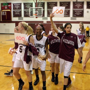  : Wildwood High School girls basketball coach Dave Troiano won his 600th career coaching victory in a win against Cape May County Technical High School. Troiano's team celebrates the win for the coach. Tuesday Jan. 29, 2013. (Dale Gerhard/Press of Atlantic City)
 - Photo by Dale Gerhard