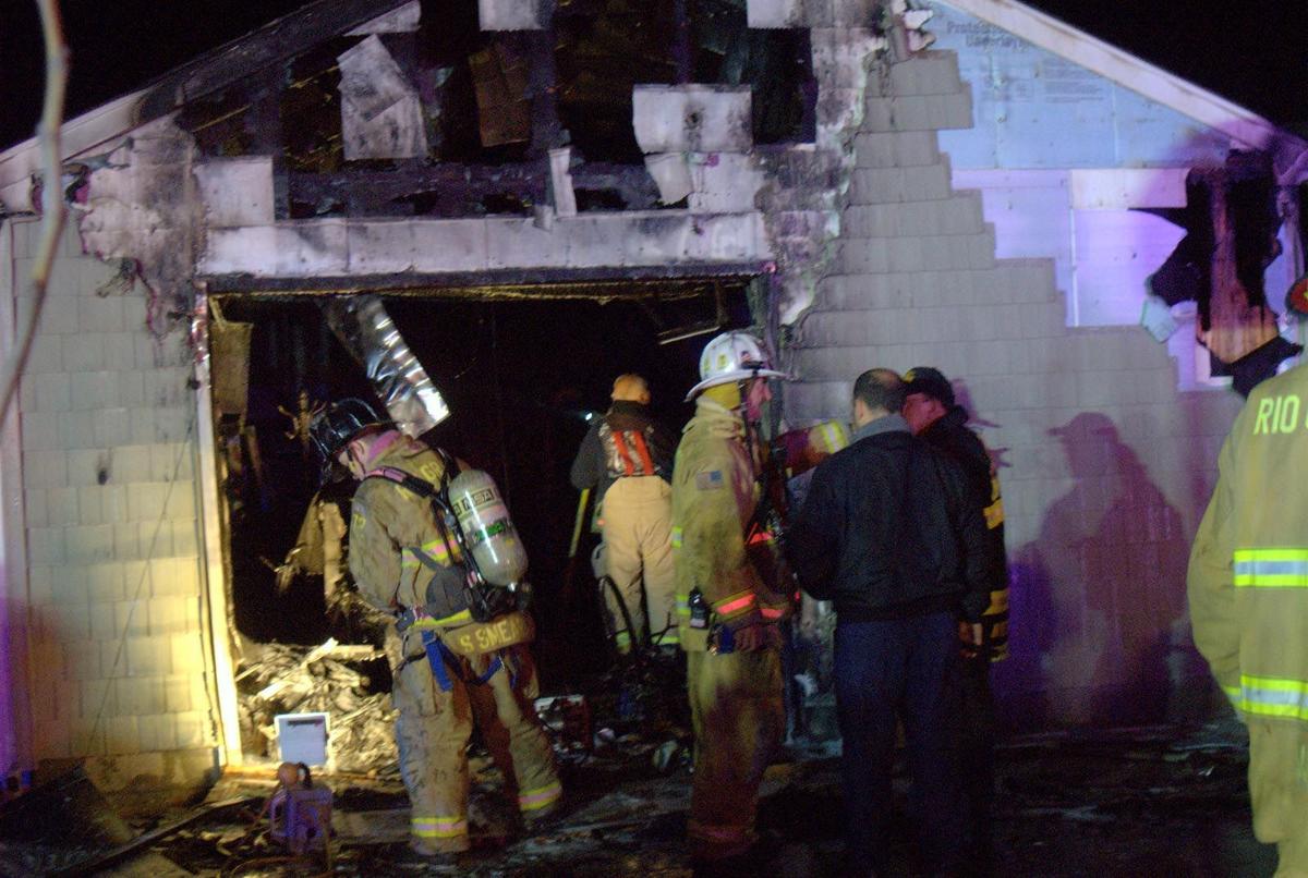 Three people escape injury in Middle house fire