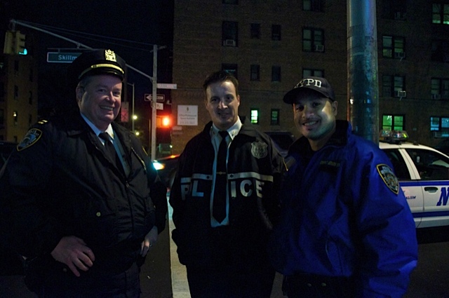 Police during the lighting ceremony on Skillman Avenue