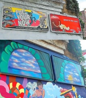 Muralist covers illegal billboards 1