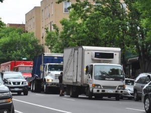 Delivery trucks crowd Skillman Ave. 1
