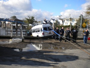 Car chase ends in van landing on boat in Hamilton Beach