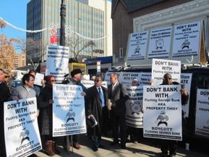 Flushing Savings Bank protesters take to Queens streets 1