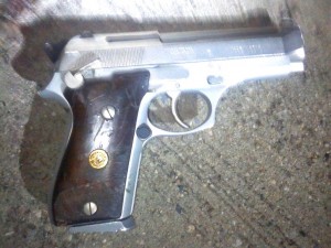 Cops: Suspect with gun shot by detective 1