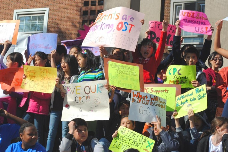Small fists raised, a protest against cuts 1