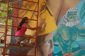 Muralist covers illegal billboards 2