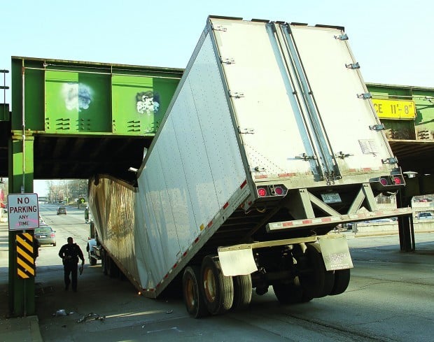 Truck hits bridge