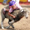 Eat dirt, sheep! Young cowboys, cowgirls try hands at mutton bustin' 