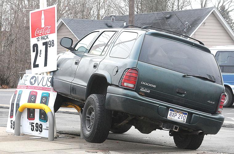 Distracted driver has mishap at gas station Beckley Register Herald: News