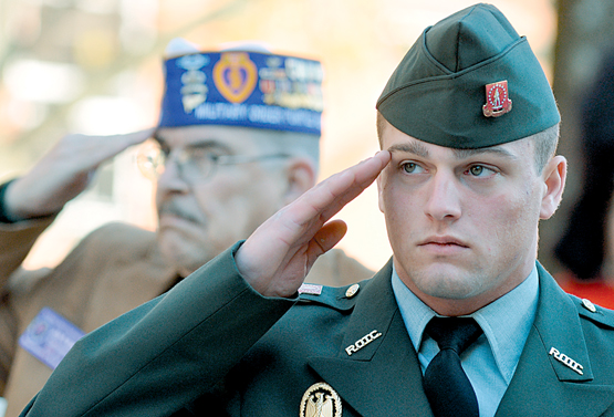 Eastern Kentucky University ROTC member William Buerger, right, and John Burch, Commander of Richmond Disabled American Veterans Post 55, participate in ... - 53cf806103911.image