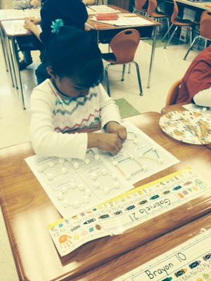 First-grade students make shapes from marshmallows